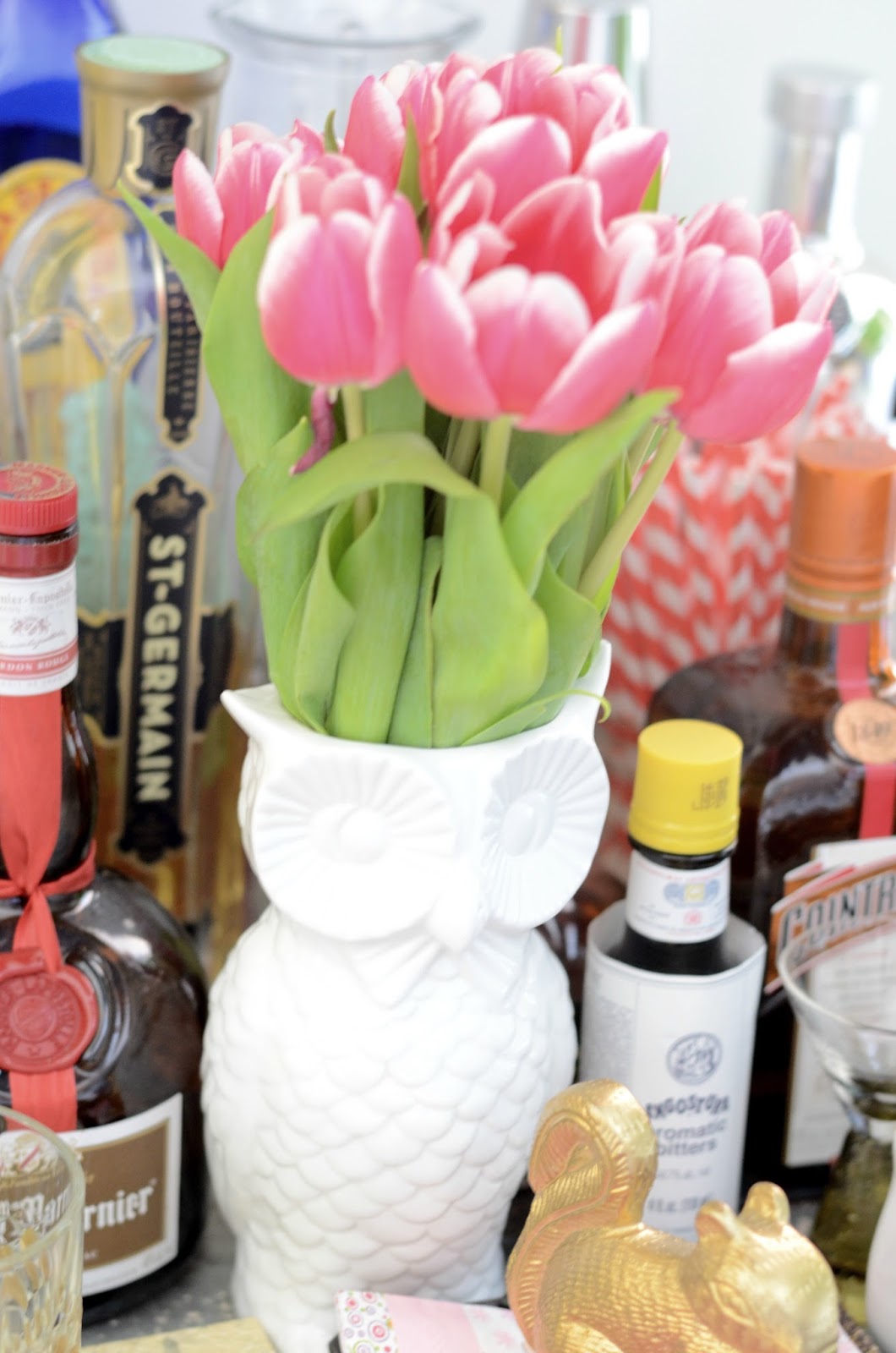 A Spring Bunch of Tulips in An Owl Vase on the Bart Cart